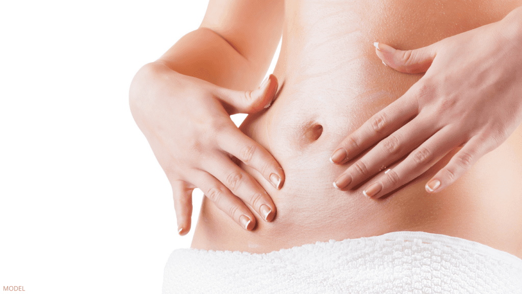 Woman worried about belly button before Tummy Tuck surgery in Charlottesville, VA.