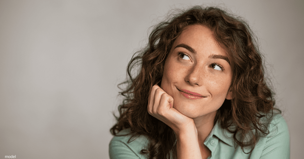 woman pondering a breast lift