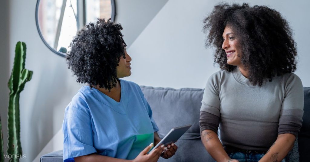 Transgender person talking to a doctor. (MODELS)